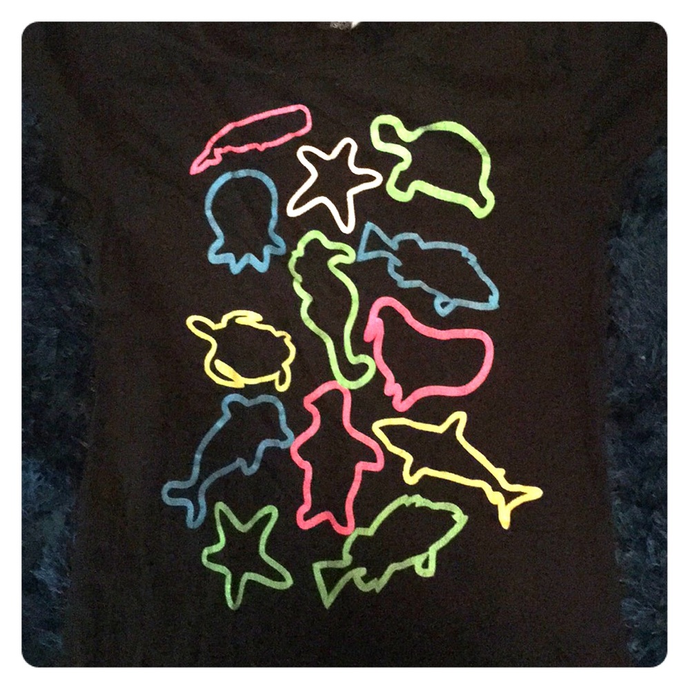 Black juniors small tee with neon animal outlines.